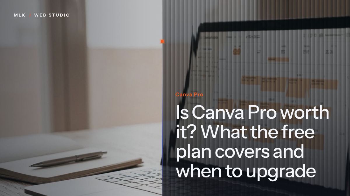 A laptop showing a content calendar beside a notebook and pen, with the words Canva Pro